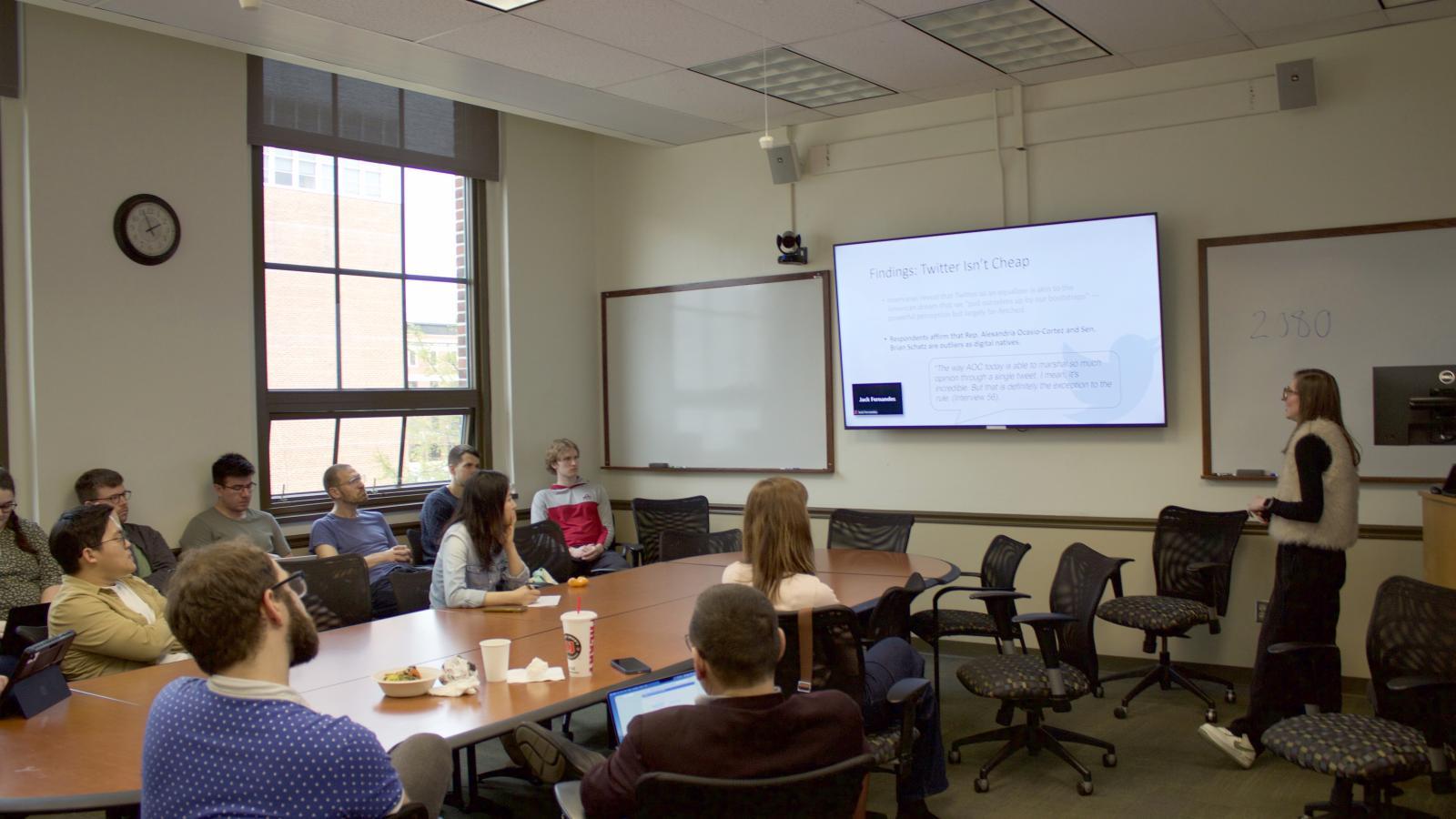 A female professor gave a speech to students.