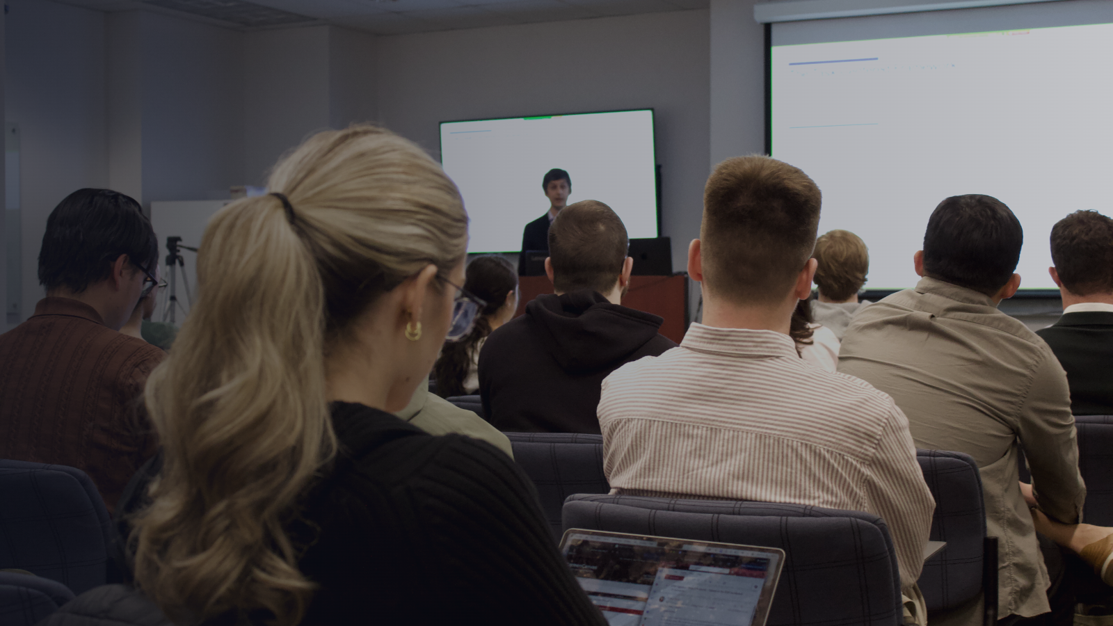 Students in the class are listening attentively to a lecture.