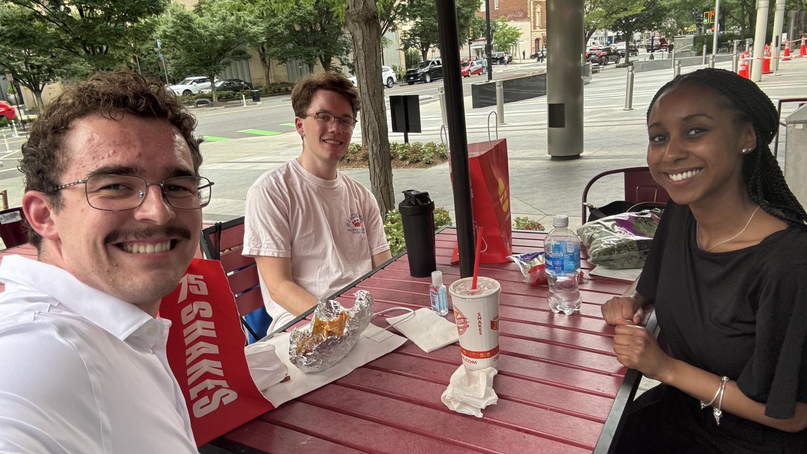 IDEA fellow: three students, one girl, and two boys in DC.