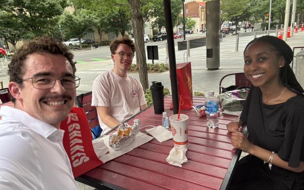 IDEA fellow: three students, one girl, and two boys in DC.