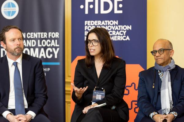 Amy Lee speaking at a panel 